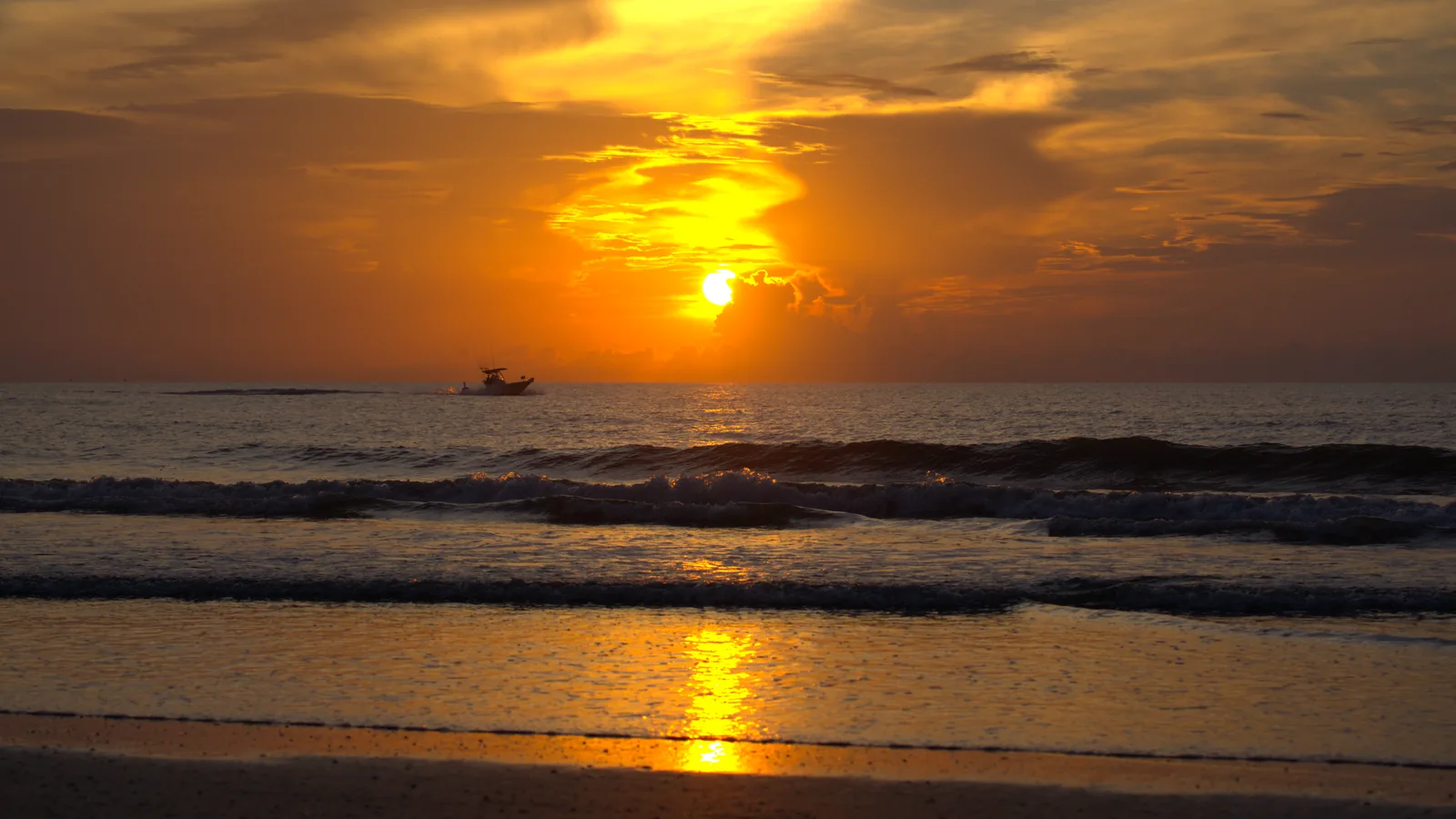 The same sunrise without PursuitLuts, loud orange with a hard edged cloud.